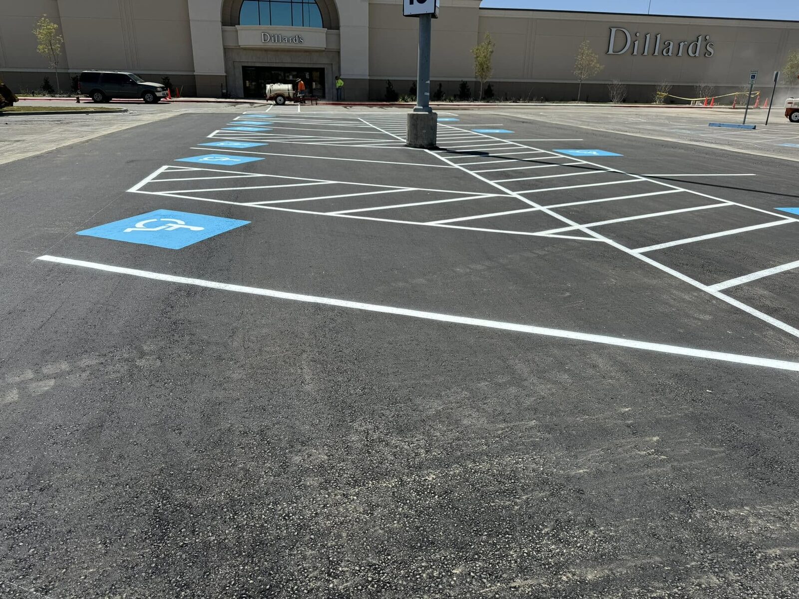 Freshly striped ADA parking spaces outside Dillard's